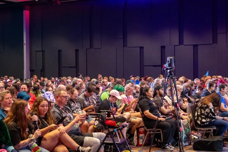 A ballroom full of Gen Con attendees waiting for the show.